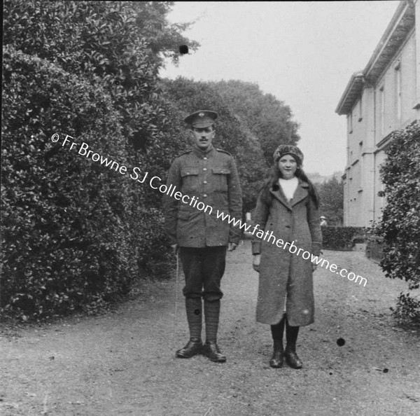 MAN IN ARMY UNIFORM WITH GIRL